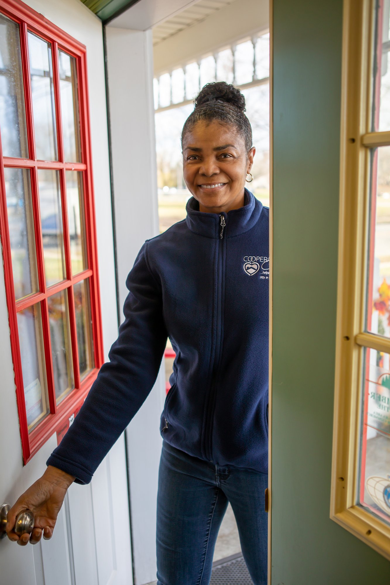 cooperative in home caregiver at the door